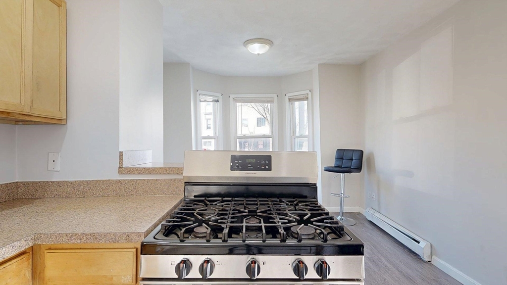 329 Paris Street, Unit 2 Boston, MA 02128 - Photo 5 of 24 a kitchen with sink and window