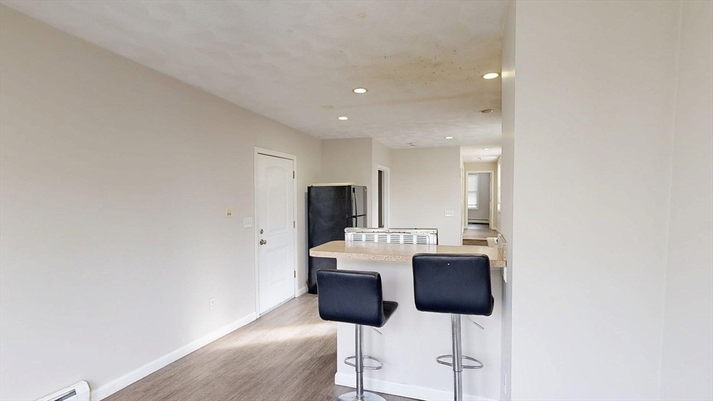 329 Paris Street, Unit 2 Boston, MA 02128 - Photo 9 of 24 a view of a dining room with furniture