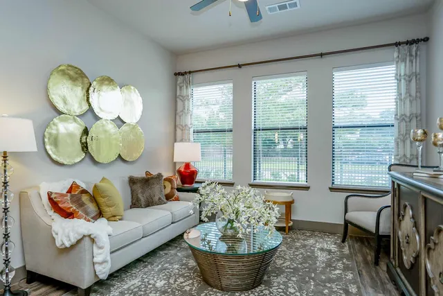 a living room with furniture and a large window