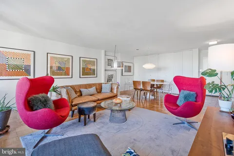 a living room with furniture and a table