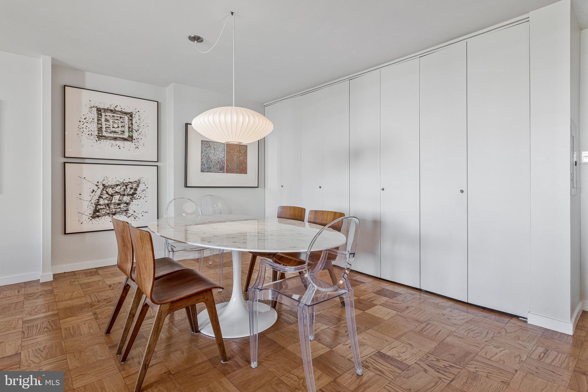 1245 4th Street Southwest, Unit E501 Washington, DC 20024 - Photo 13 of 40 a view of a dining room with furniture and wooden floor