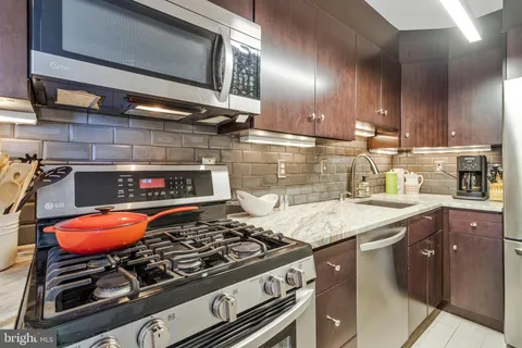 a kitchen with a stove and a sink