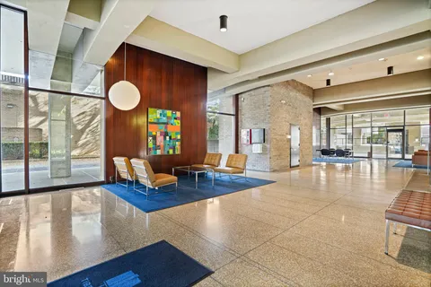 a lobby with furniture and a large window