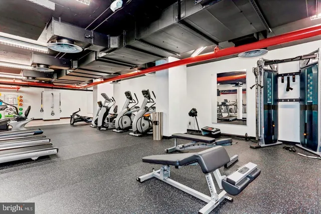a view of gym room with gym equipment