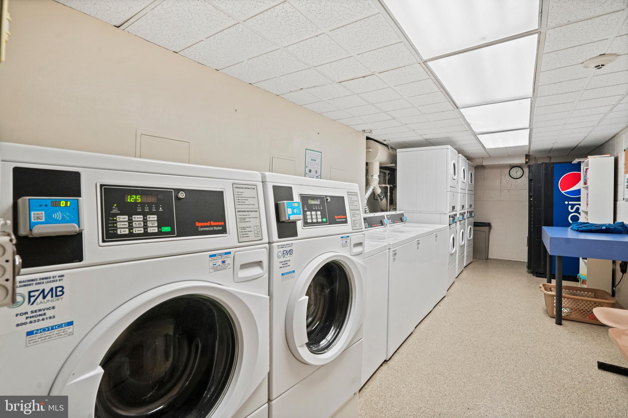 1245 4th Street Southwest, Unit E501 Washington, DC 20024 - Photo 28 of 40 a view of livingroom with washer and dryer