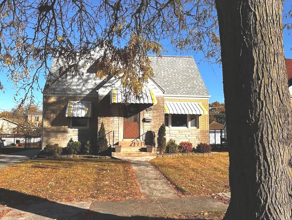 a view of a house with snow on the background