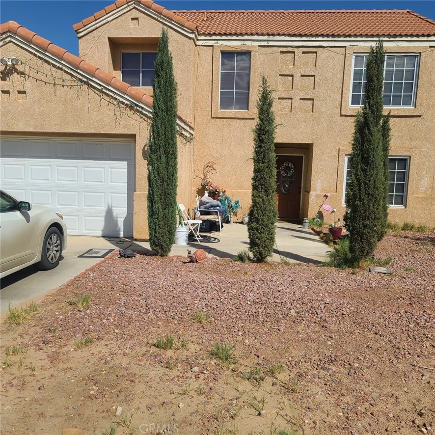 10452 Mendicino Road Adelanto, CA 92301 - Photo 1 of 1 a view of a house with backyard of the house