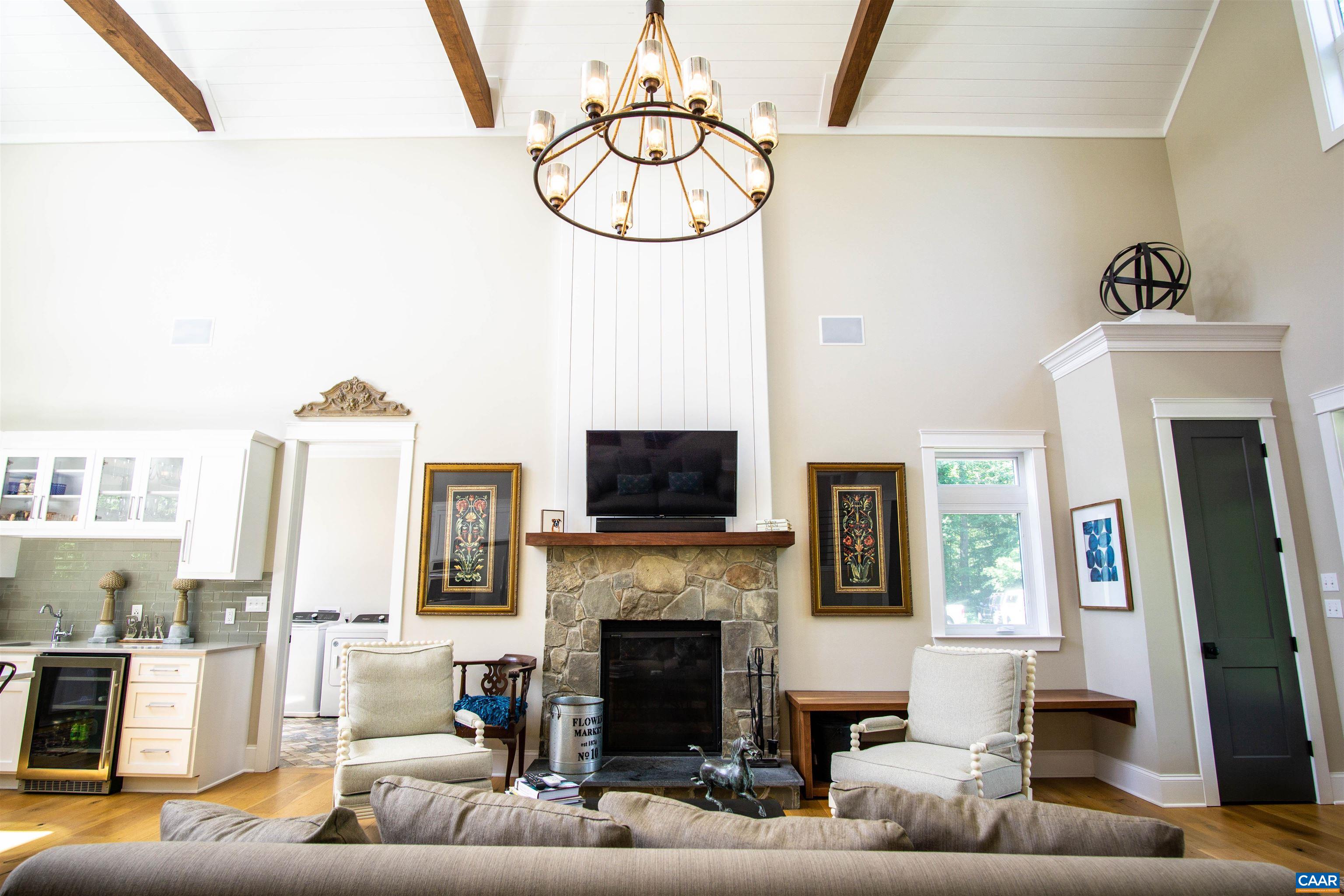 2236 Moore Road Ruckersville, VA 22968 - Photo 12 of 69 a living room with furniture a fireplace and a flat screen tv