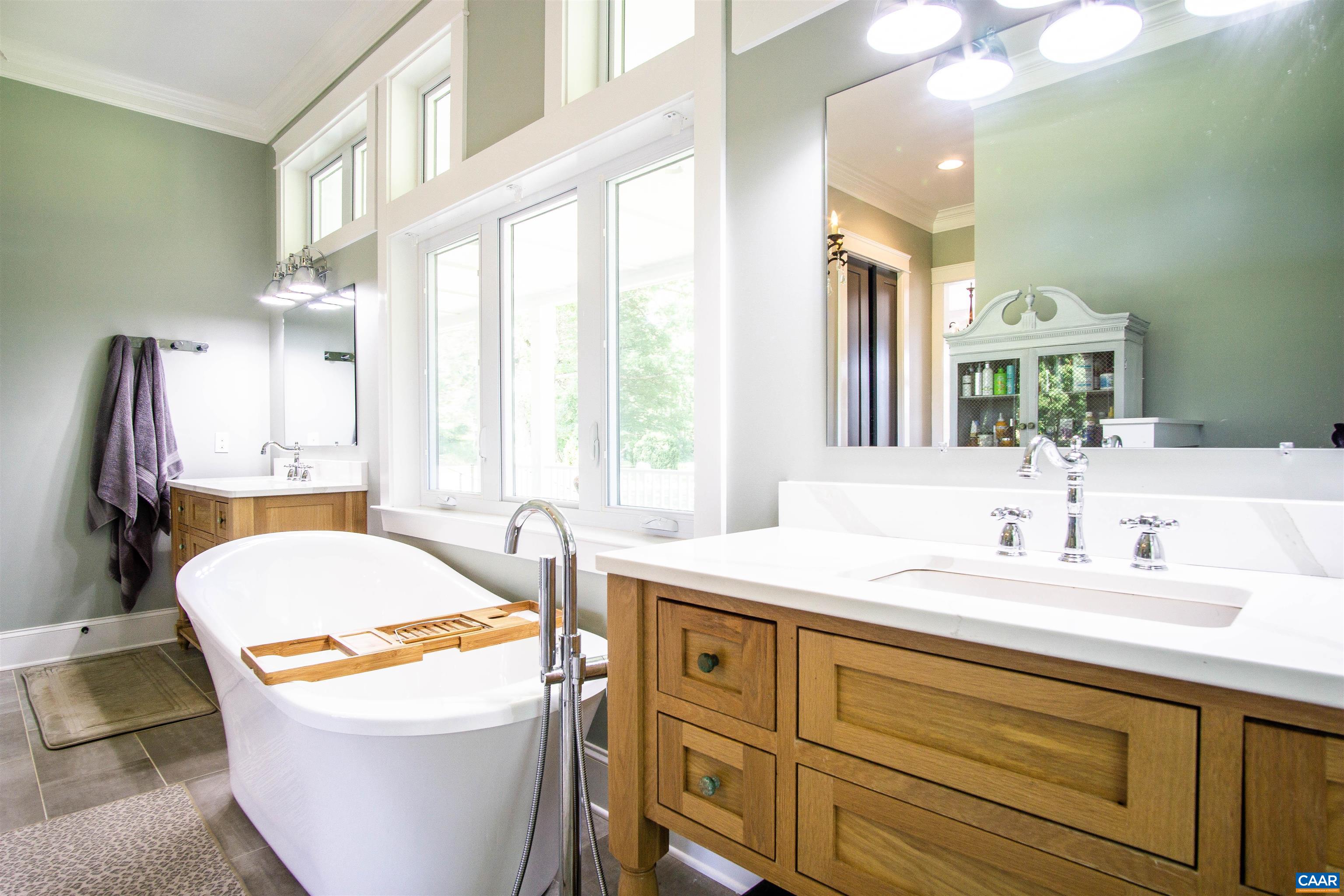2236 Moore Road Ruckersville, VA 22968 - Photo 25 of 69 a bathroom with a granite countertop sink and a mirror