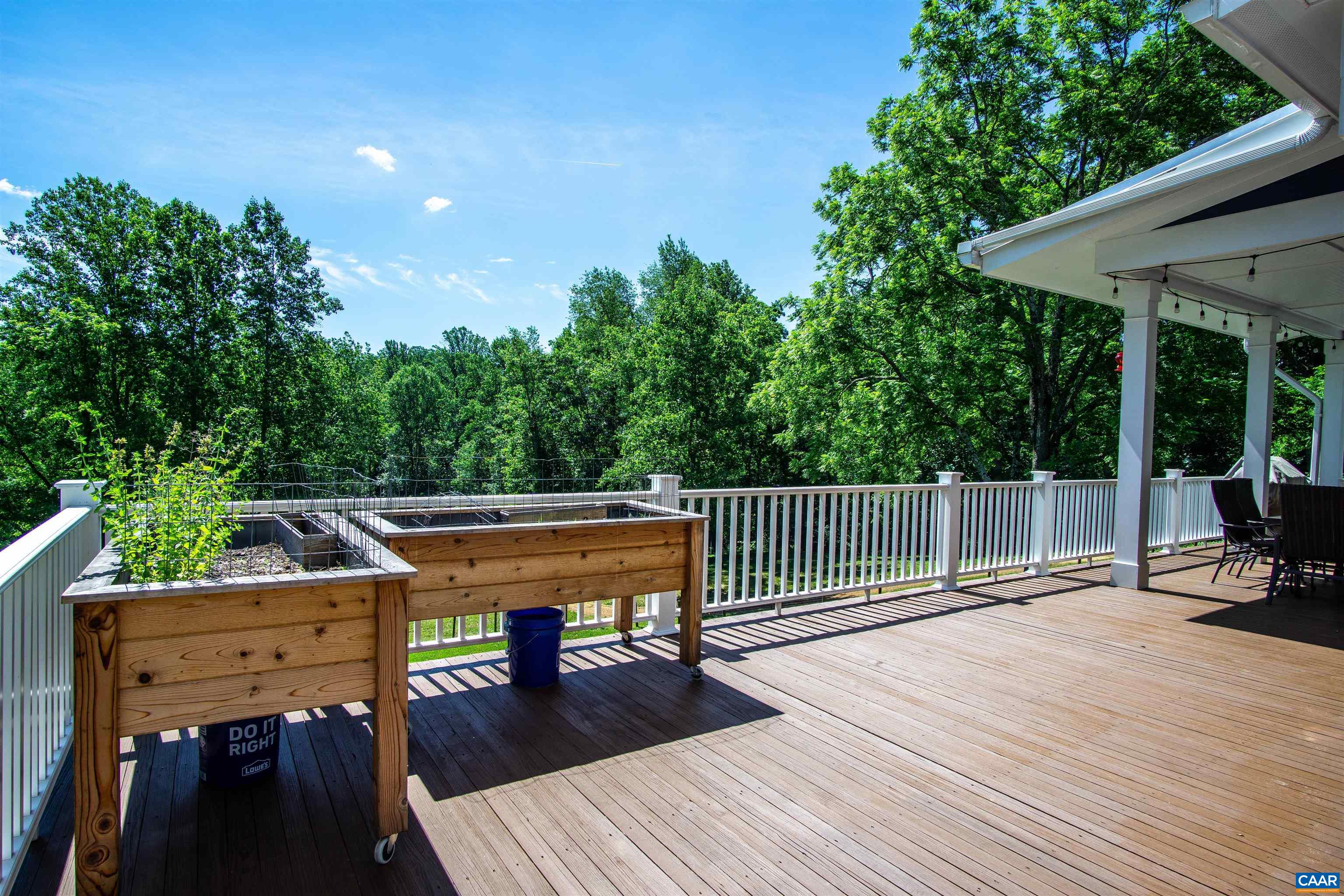 2236 Moore Road Ruckersville, VA 22968 - Photo 32 of 69 a view of a deck with furniture and a backyard