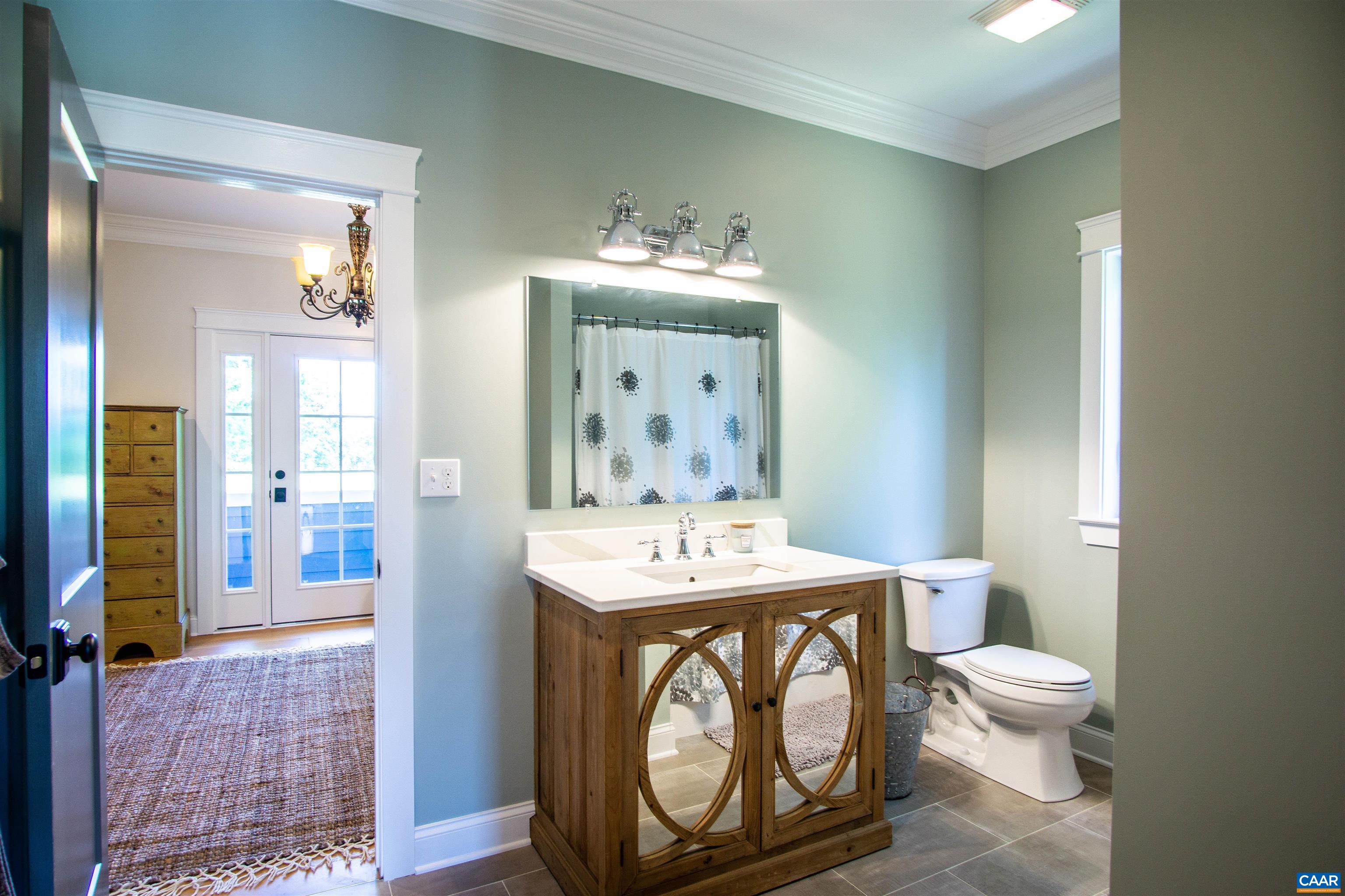 2236 Moore Road Ruckersville, VA 22968 - Photo 38 of 69 a bathroom with a toilet a sink and a mirror