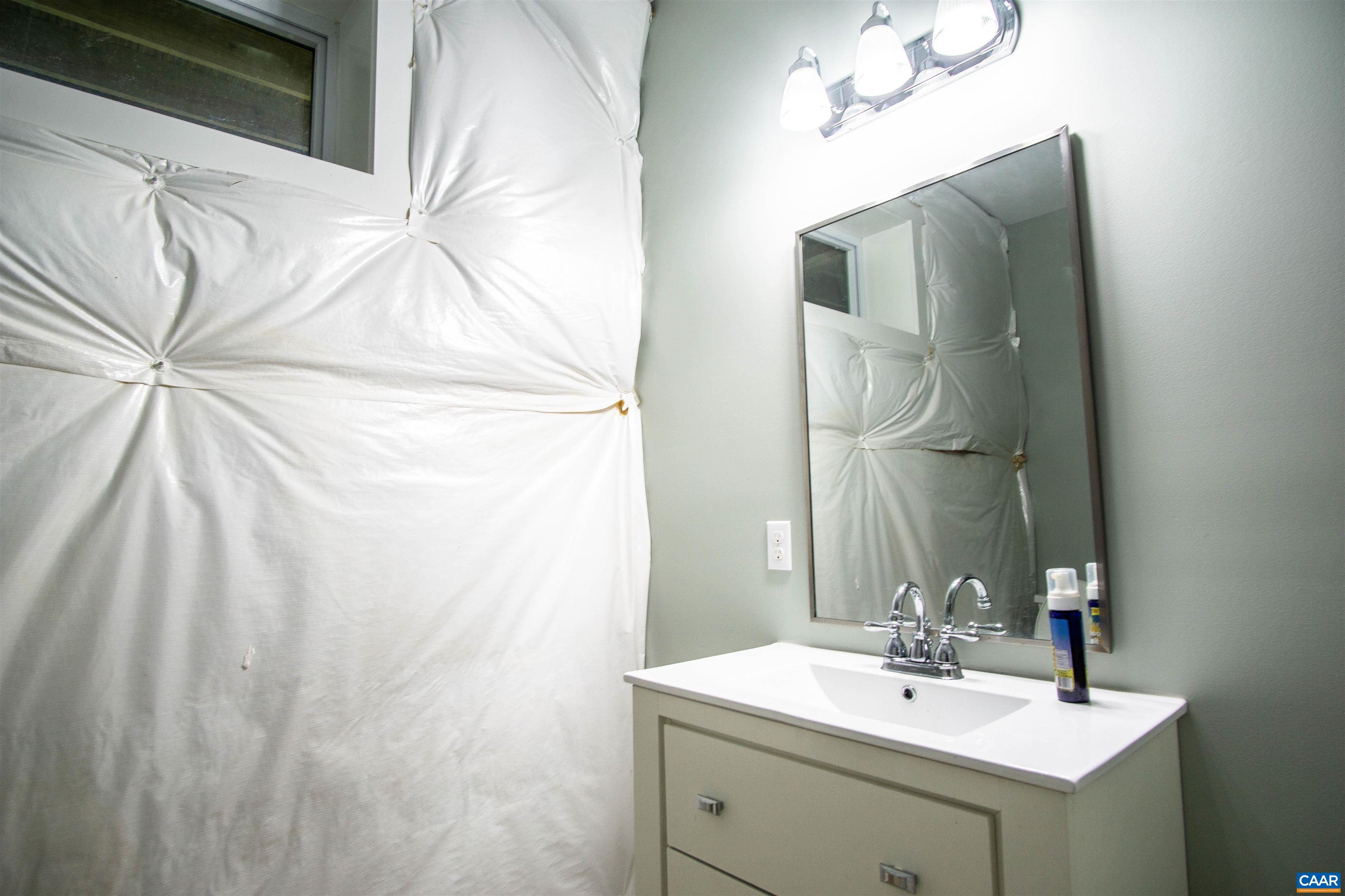 2236 Moore Road Ruckersville, VA 22968 - Photo 52 of 69 a bathroom with a sink vanity and mirror