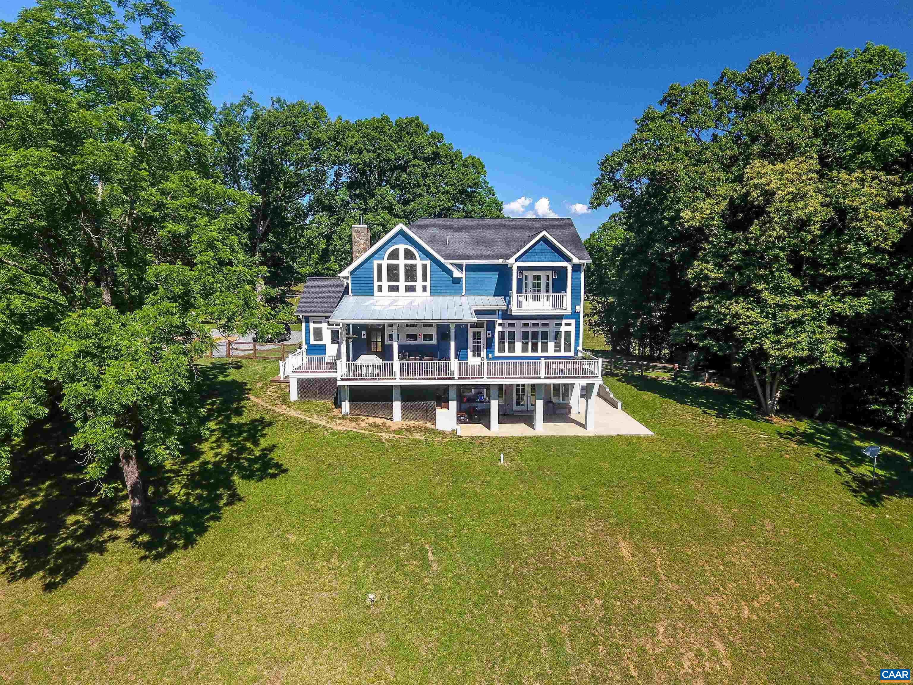 2236 Moore Road Ruckersville, VA 22968 - Photo 59 of 69 a view of a house with a big yard and large trees