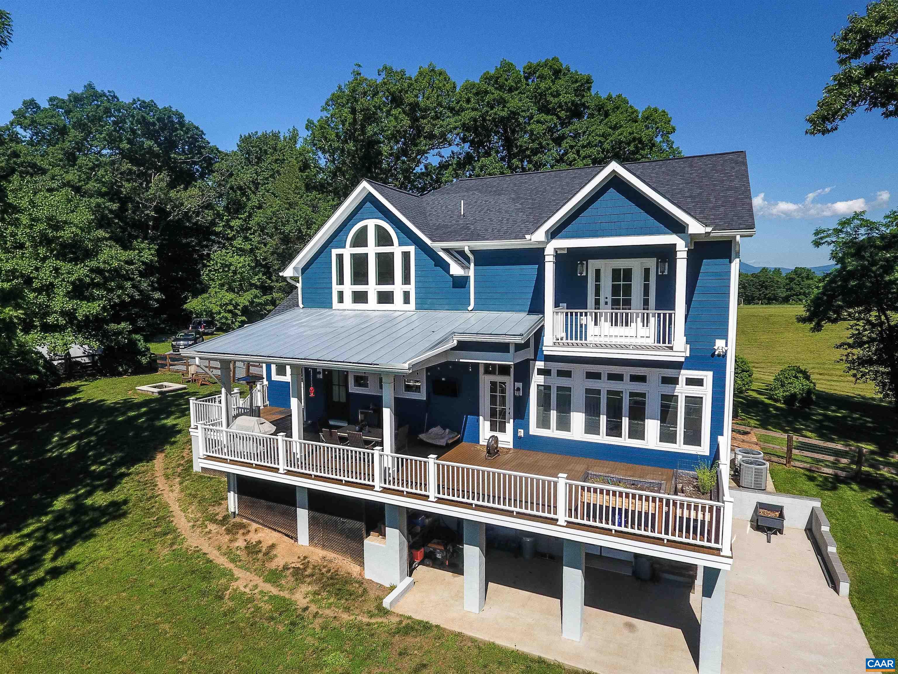 2236 Moore Road Ruckersville, VA 22968 - Photo 63 of 69 a front view of a house with balcony