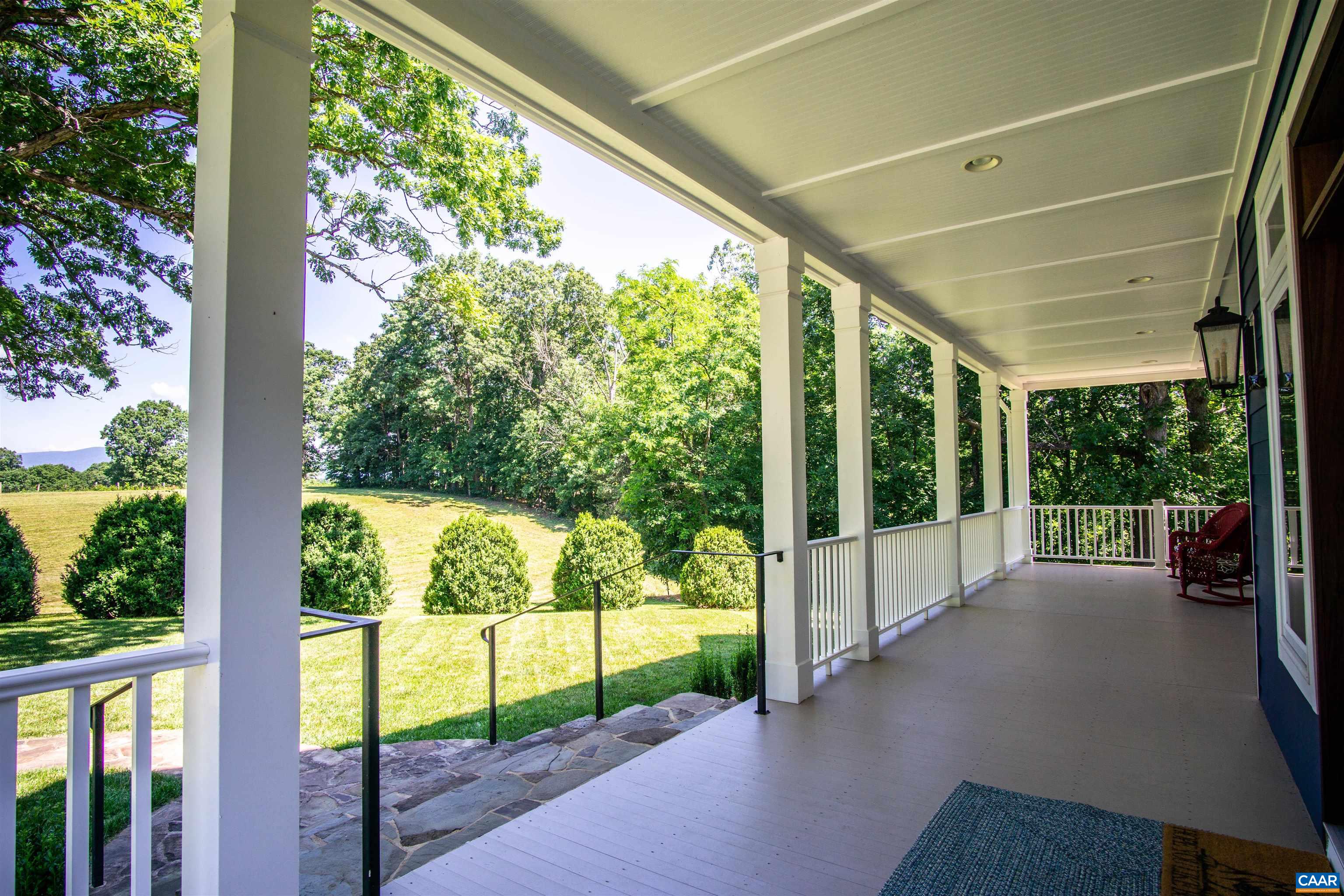2236 Moore Road Ruckersville, VA 22968 - Photo 7 of 69 a view of porch with a floor to ceiling window and wooden floor