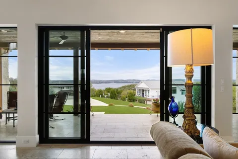 a living room with a large window with outer view