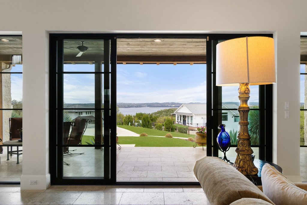 a living room with a large window with outer view