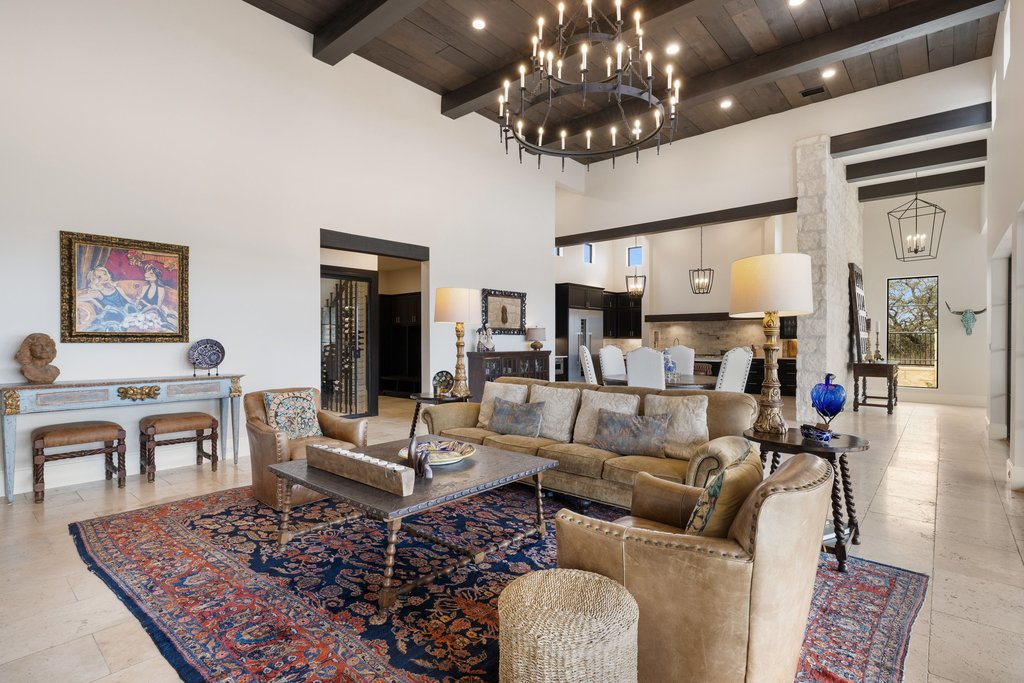 4001 Tejon Circle Austin, TX 78734 - Photo 15 of 40 a living room with furniture and a chandelier