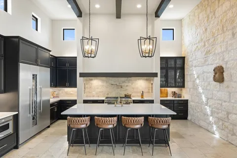 a bathroom with double vanity sinks double vanity tub shower and a mirror