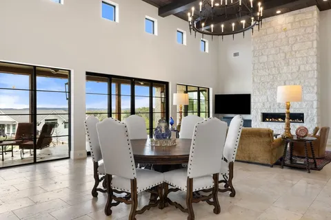 a living room with furniture a flat screen tv and a window