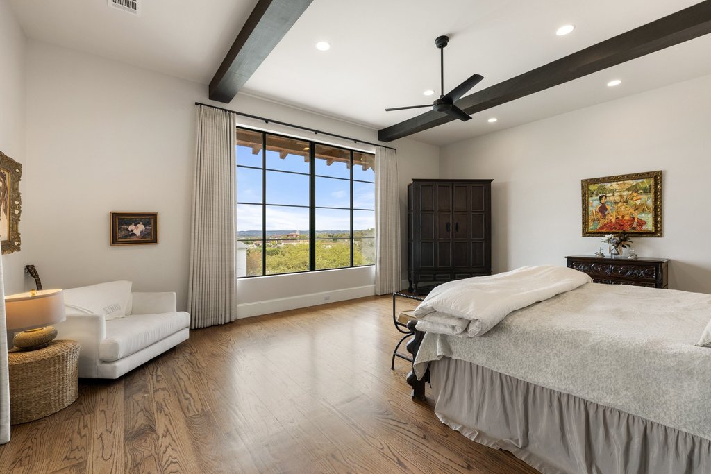 4001 Tejon Circle Austin, TX 78734 - Photo 23 of 40 a bedroom with a large bed and a large window
