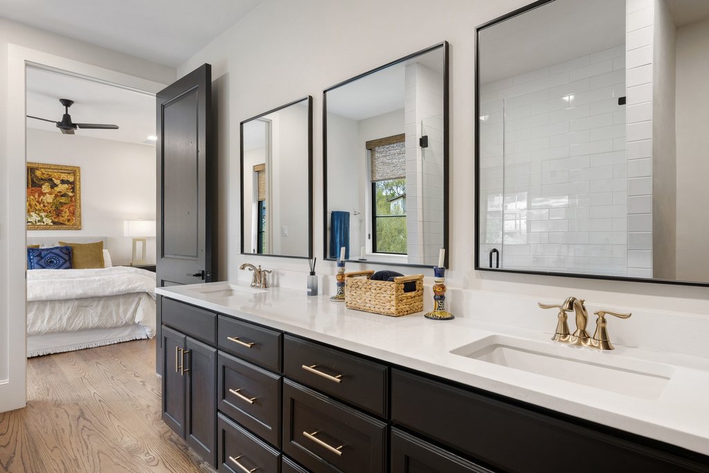 4001 Tejon Circle Austin, TX 78734 - Photo 30 of 40 a bathroom with double vanity sinks double vanity tub shower and a mirror