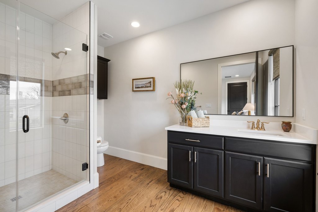 4001 Tejon Circle Austin, TX 78734 - Photo 34 of 40 a bathroom with a double vanity sink mirror and shower
