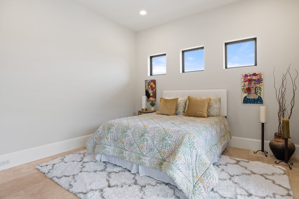 4001 Tejon Circle Austin, TX 78734 - Photo 35 of 40 a bedroom with a bed and a painting on the wall