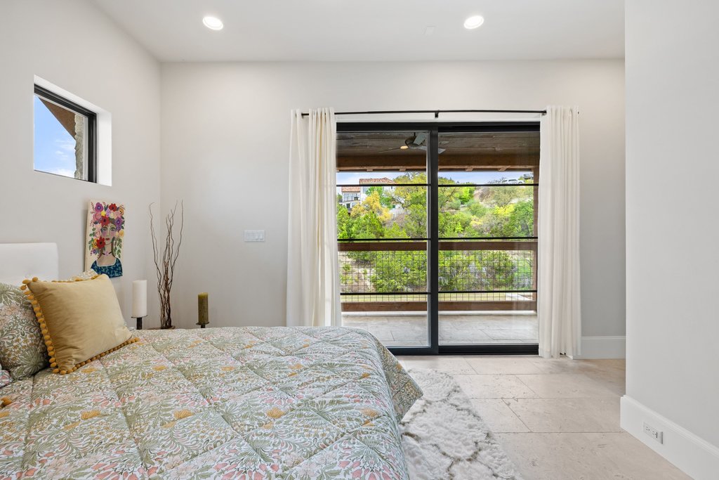 4001 Tejon Circle Austin, TX 78734 - Photo 37 of 40 a bedroom with a bed and a large window