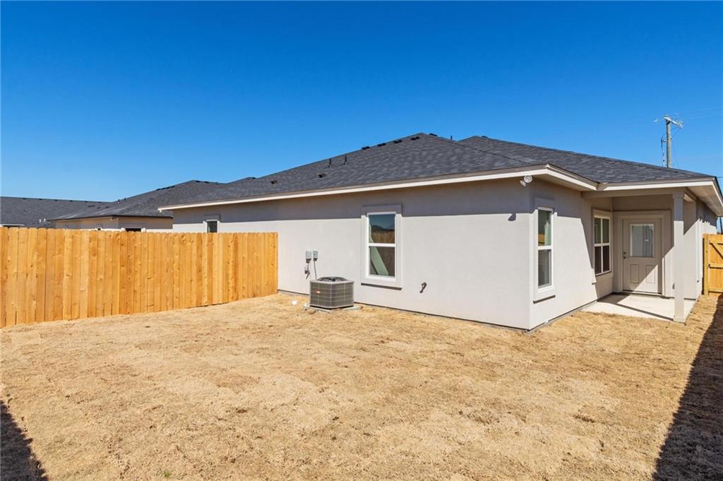 365 County Road 306, Unit A Jarrell, TX 76537 - Photo 8 of 9 a view of a house with a yard