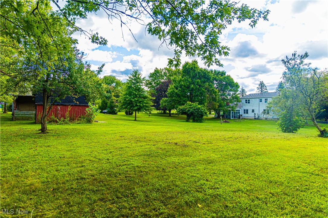 16974 Hawley Road Oberlin, OH 44074 - Photo 39 of 42 View of grassy yard with an outdoor structure