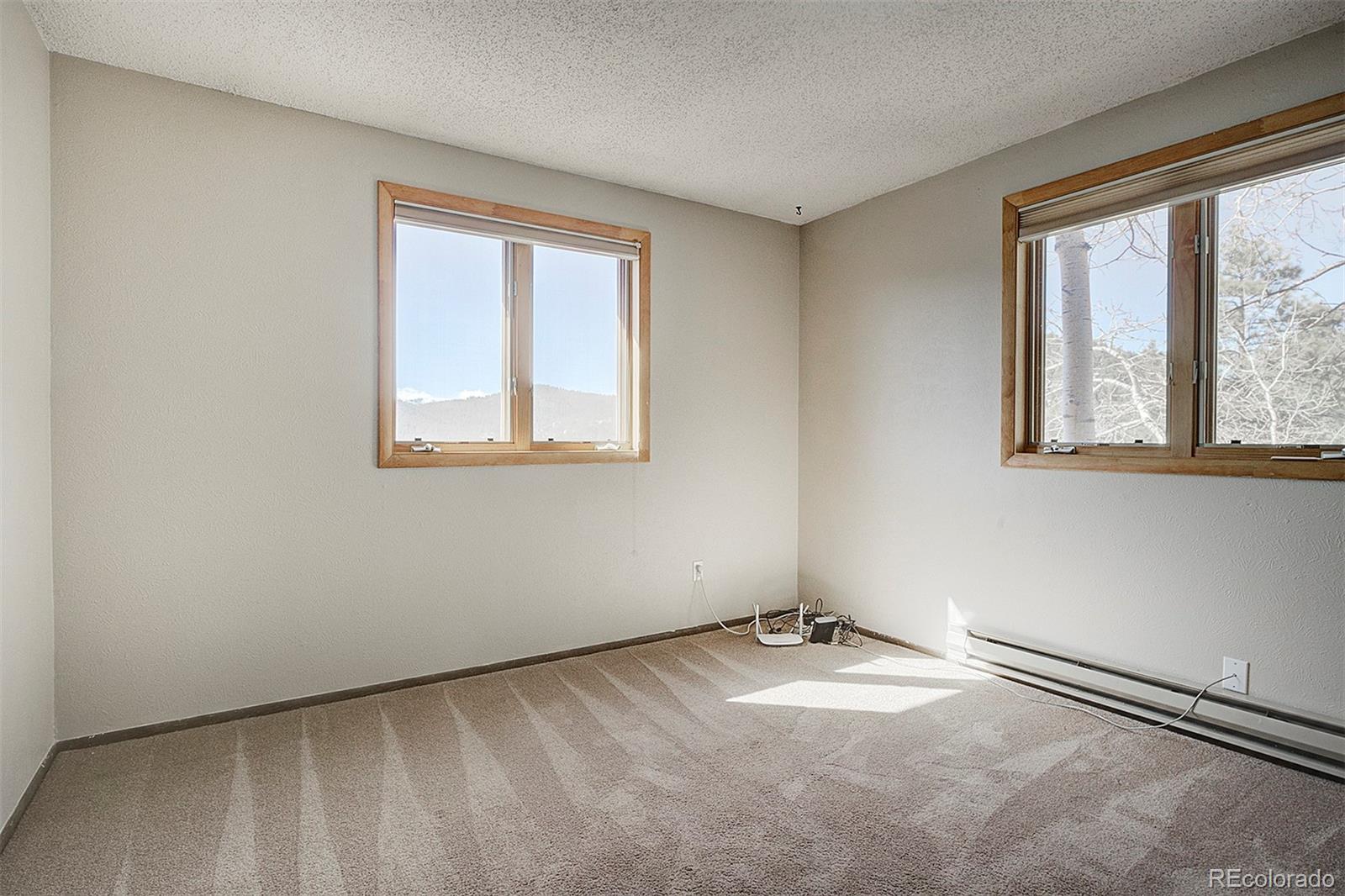 6561 Ridgeview Drive Morrison, CO 80465 - Photo 17 of 36 an empty room with a window