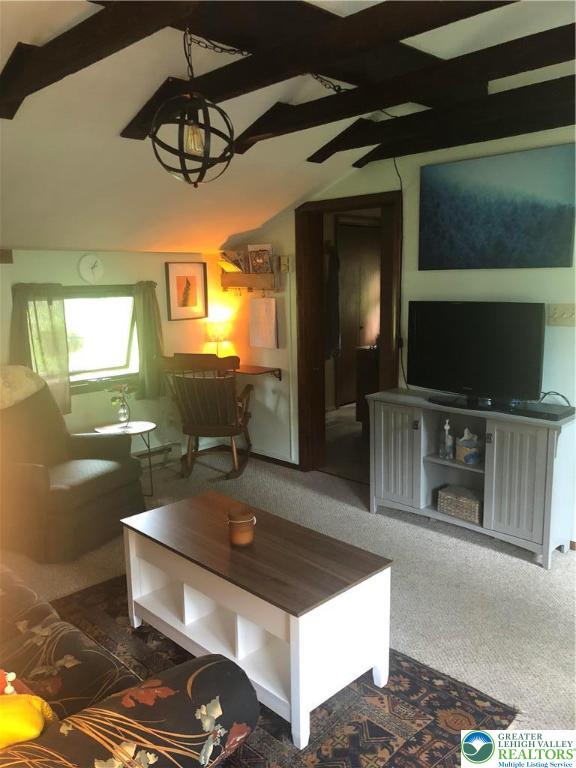 810 Dragonhead Way Stroudsburg, PA 18360 - Photo 19 of 21 a living room with furniture and a flat screen tv