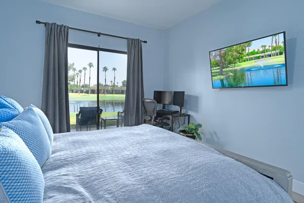 an outdoor sitting area with a table and chairs