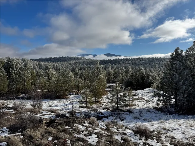 a view of a large body of water with a building in the background