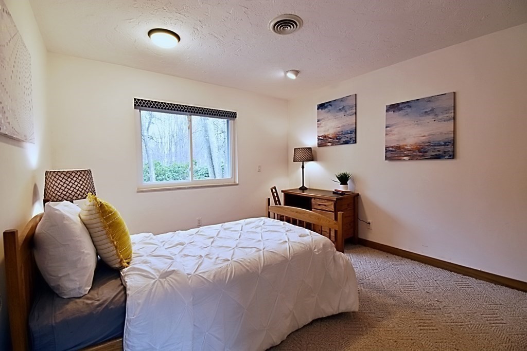 8 McCarthy Circle Framingham, MA 01702 - Photo 21 of 42 a bedroom with a bed and a window