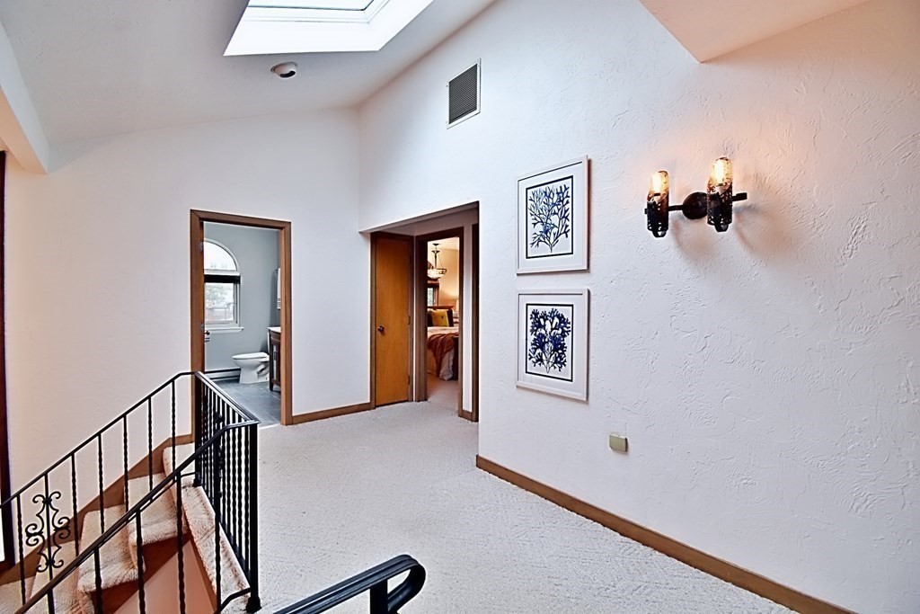 8 McCarthy Circle Framingham, MA 01702 - Photo 27 of 42 a view of a hallway with windows