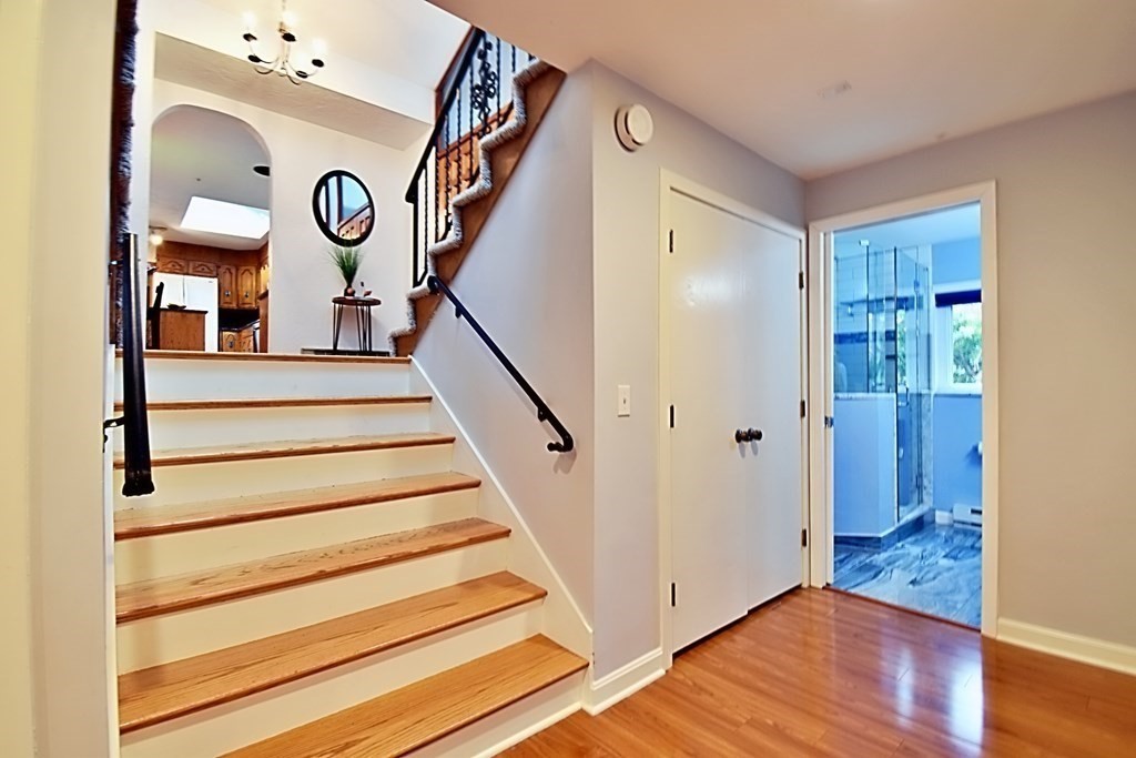 8 McCarthy Circle Framingham, MA 01702 - Photo 29 of 42 a view of entryway with stairs and wooden floor