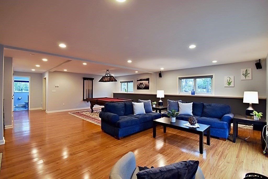 8 McCarthy Circle Framingham, MA 01702 - Photo 34 of 42 a living room with furniture and a wooden floor
