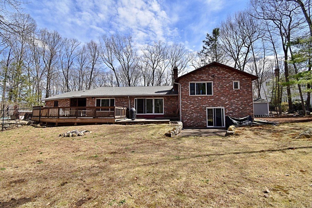 8 McCarthy Circle Framingham, MA 01702 - Photo 36 of 42 a front view of a house with yard covered in snow