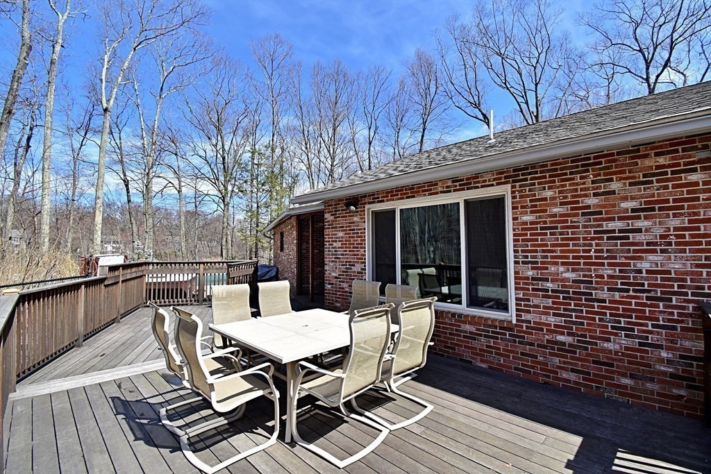 8 McCarthy Circle Framingham, MA 01702 - Photo 40 of 42 a view of a patio with a table and chairs