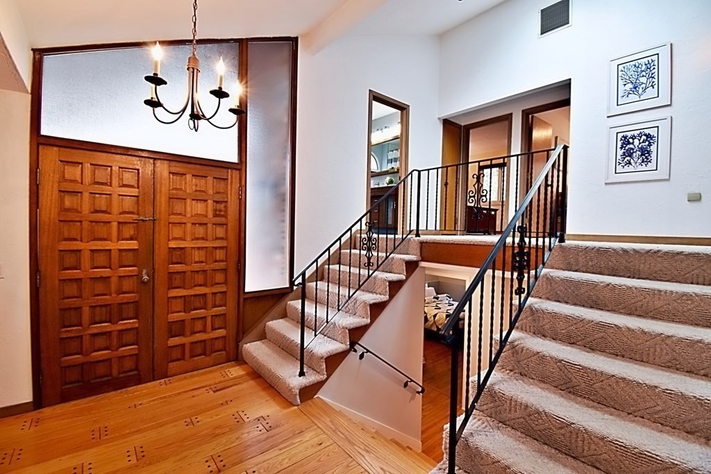 8 McCarthy Circle Framingham, MA 01702 - Photo 4 of 42 a view of an entryway with wooden floor