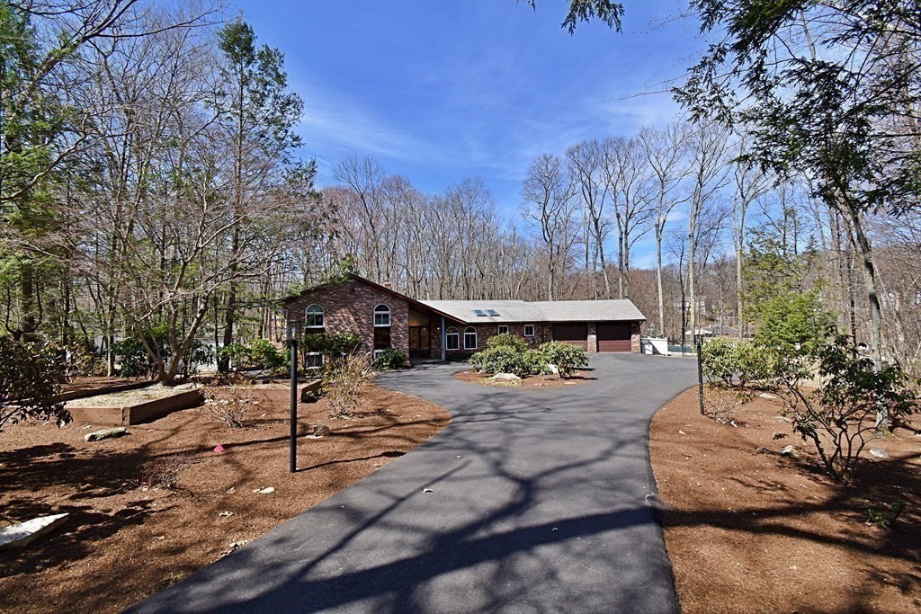 8 McCarthy Circle Framingham, MA 01702 - Photo 42 of 42 a view of a house with a yard covered in snow