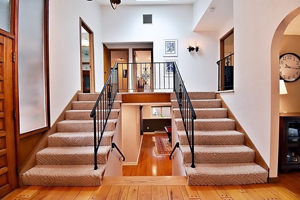 8 McCarthy Circle Framingham, MA 01702 - Photo 5 of 42 wooden floor living room with furniture and entryway