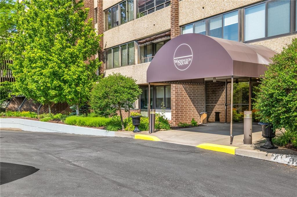 a view of a house with a yard and plants