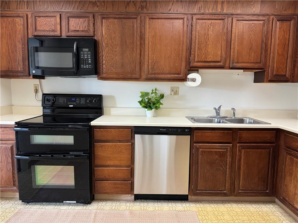 750 Washington Road, Unit 409 Pittsburgh, PA 15228 - Photo 12 of 21 a kitchen with stainless steel appliances granite countertop a stove microwave and cabinets
