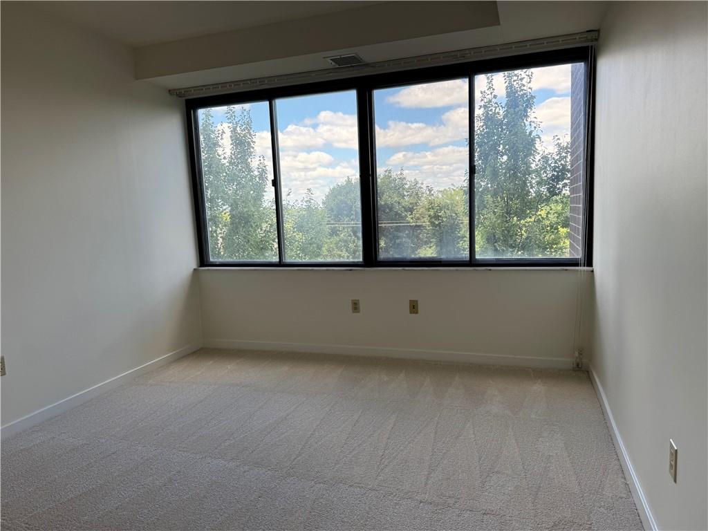 750 Washington Road, Unit 409 Pittsburgh, PA 15228 - Photo 15 of 21 an empty room with a large window