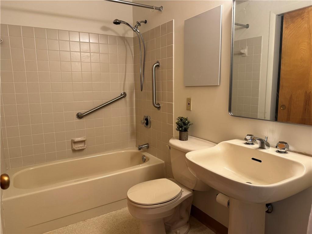750 Washington Road, Unit 409 Pittsburgh, PA 15228 - Photo 16 of 21 a bathroom with a sink toilet and shower