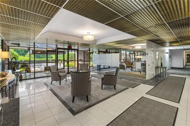 a view of a patio with a dining table and chairs