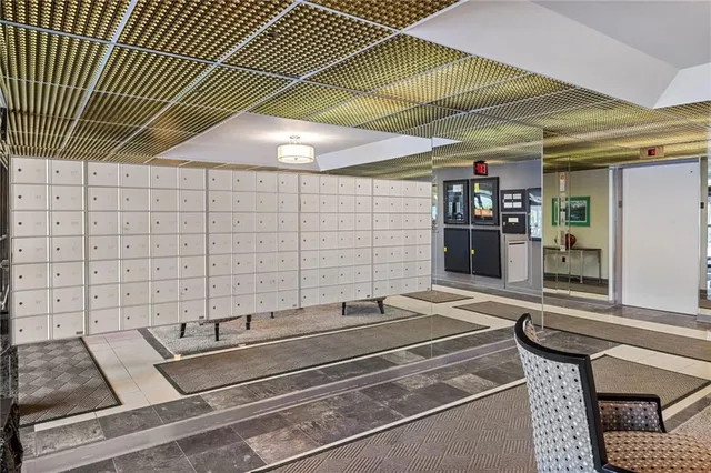 a view of a room with furniture and a potted plant